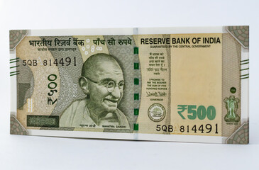 A new 500 INR currency note against white background - economy concept