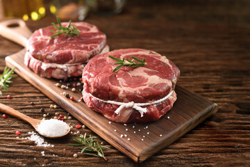 Fresh raw pieces of beef meat on a cutting board