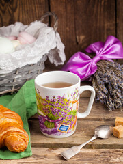 cup of tea with cookies and flowers