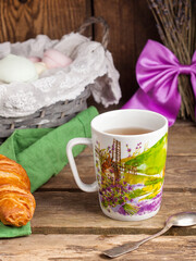 cup of tea with cookies and flowers