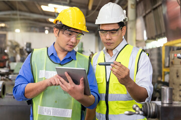 Technicians and engineers are comparing parts of the spare parts to the samples from Tablet in industrial plants