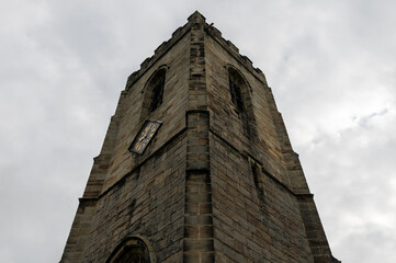 Fototapeta na wymiar Church tower of All Saints Church of England church built in 1517 in Darton, South Yorkshire