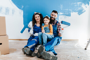 Happy family renovating their home.