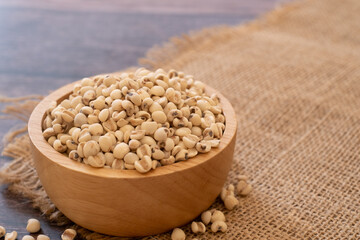 Bowl of Adlay millet or pearl millet or Job's tears in wooden bowl on the sackcloth over wooden...