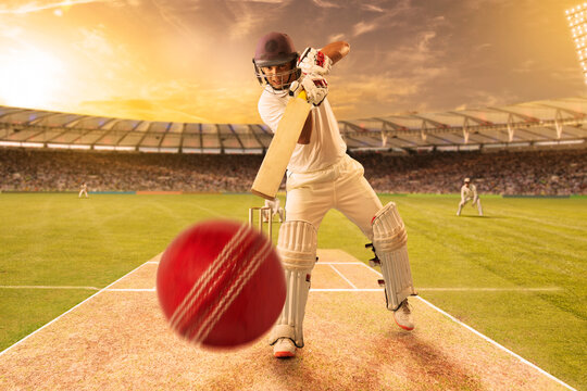 Cricketer batsman hitting a shot during a match on the pitch - Powered by Adobe