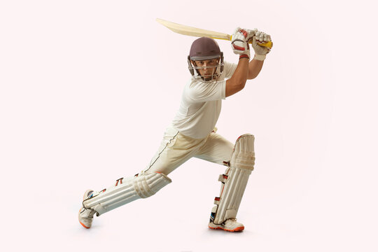 Cricketer batsman hitting a shot. 	