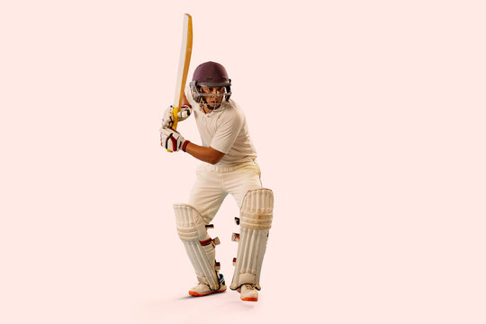 Cricketer batsman ready to hit a shot. 	