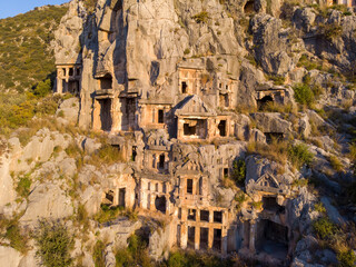Fototapeta premium Aerial Shot Archeological remains of the Lycian rock cut tombs in Myra, Turkey