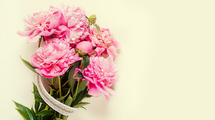 Top view of pink peony flowers with copy space. Floral background.