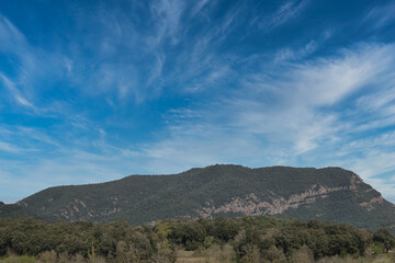 mountainous landscape with open sky and blue background