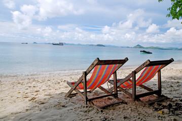 Seascape of couple Red Beach Chair on the sand beach at koh kham island sattahip chonburi thailand. Beautiful Nature Relax and Travel sightseeing 
