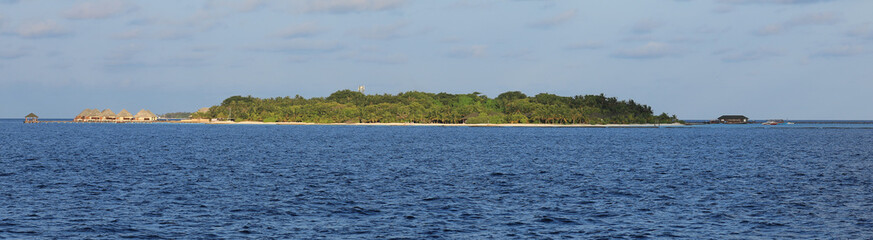 Fototapeta na wymiar tropical resort beach with palm trees island in Indian Ocean