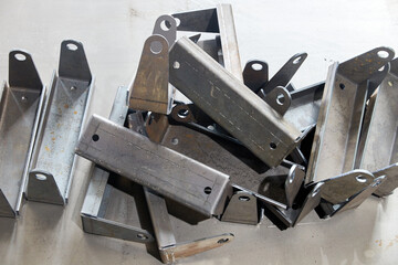 pile of metal products in workshop after bending