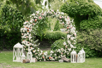 Wedding ceremony. Very beautiful and stylish roundwedding arch, decorated with various fresh...