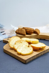 Crispy bread cubes, dry re crumbs, rusks, crouton or brown roasted crackers.