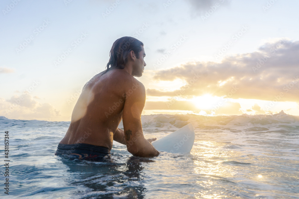 Canvas Prints young caucasian man get up early to doing surf at sunrise