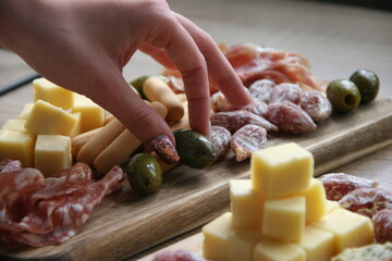 Meat and cheese plate with olives