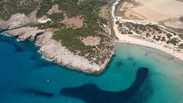 Aerial panorama view of the famous semicircular sandy beach and lagoon of Voidokilia in Messenia, Greece