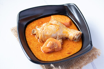 Chicken Mussaman Curry in black cups