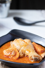 Chicken Mussaman Curry in black cups