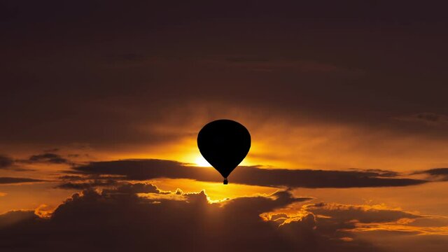 The flight on air balloon in the beautiful sunset sky