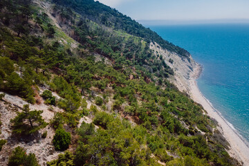 Aerial view of coastline with blue sea and highest cliff. Summer day at Black sea