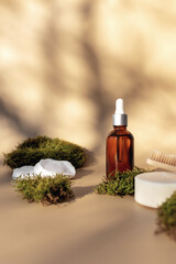 Healthcare concept with bath accessories on beige background with green moss