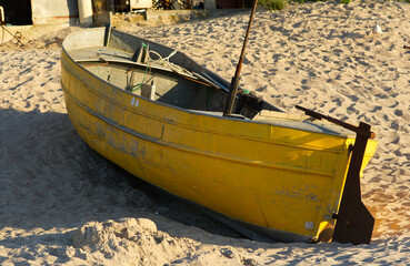 old fish boat on the beach