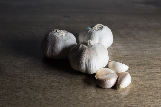 raw Garlic on Wood background