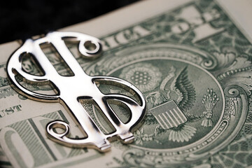 Dollar closeup. Money macro. A stack of cash in a silver clip.                            