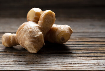 Ginger placed on an old wooden background.