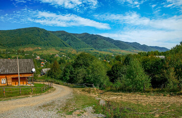Mount Krasiya. Transcarpathia, Ukraine. The entrance to the village against the background of the...