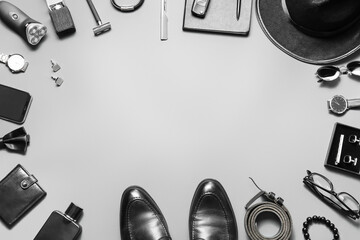 Frame made of male accessories on light background