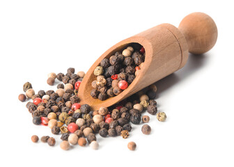Scoop with peppercorns on white background