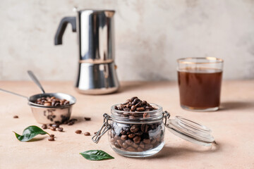 Jar with coffee beans on color background