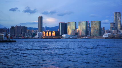 Fototapeta na wymiar Hong Kong - June 25, 2016: sunset view in Hong Kong, Kow Loon district, Central district in Hong Kong. Victoria Harbour. Illustrative editorial , city skyline at sunset