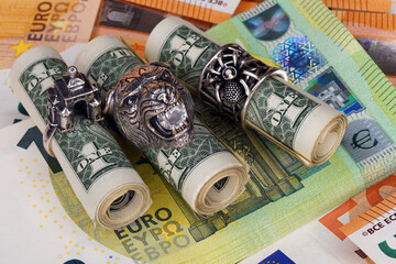 Dollars close-up. Money macro. Banknotes are rolled up by a roller in a silver rings. Accessory. Cash. European currency                              