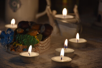 Obraz na płótnie Canvas romantic tealights, candles in a dim floor