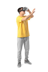 Young man with virtual reality glasses on white background