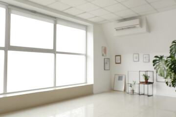 Interior of modern art gallery, blurred view