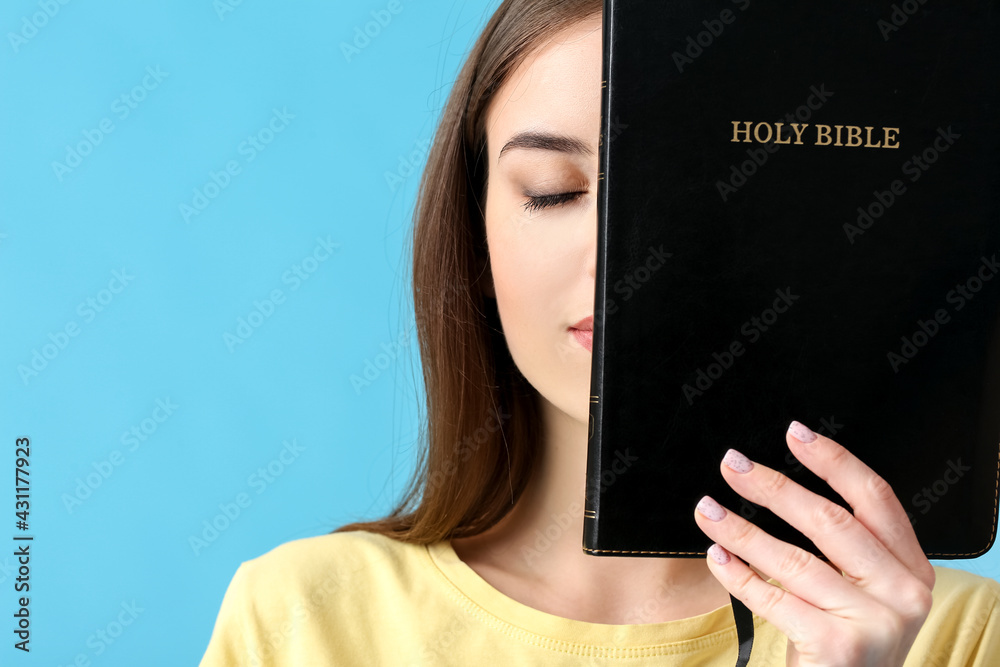 Canvas Prints young woman with bible on color background - Canvas Prints