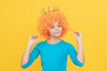 fancy party look. egocentric kid in clown wig and crown. imagine herself a princess.