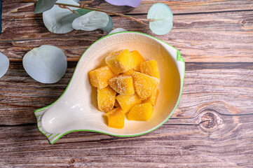 frozen mango with wood background