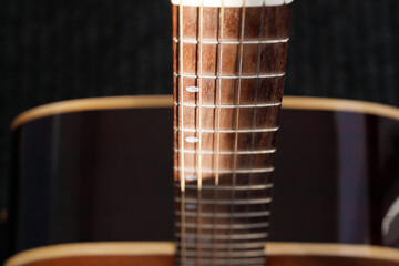 Abstract background of musical stringed instruments. Wood. Sound wave. Classical guitar close-up. ...