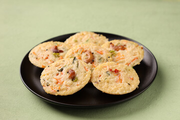 South Indian breakfast rava idli or semolina idly , Suji idly with coconut chutney. Very popular dish in Kerala, Tamil Nadu, India , Sri Lanka.  healthy Steamed food 