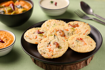 South Indian breakfast rava idli or semolina idly , Suji idly with coconut chutney. Very popular dish in Kerala, Tamil Nadu, India , Sri Lanka.  healthy Steamed food 