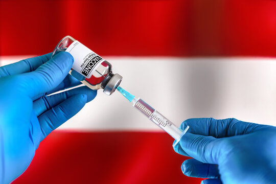 Injecting dose of vaccine in syringe for infections prevention in front of the Austria flag. Doctor preparing vial of vaccine injection for the vaccination plan against diseases in Austria