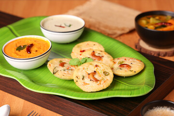 South Indian breakfast rava idli or semolina idly , Suji idly with coconut chutney. Very popular dish in Kerala, Tamil Nadu, India , Sri Lanka.  healthy Steamed food 