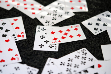 Playing cards on a black background top view. Leisure and entertainment                               