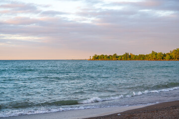 Looking across Ashbridges Bay from the Kew Beach Dog Park in Toronto just after sunrise in the summer.